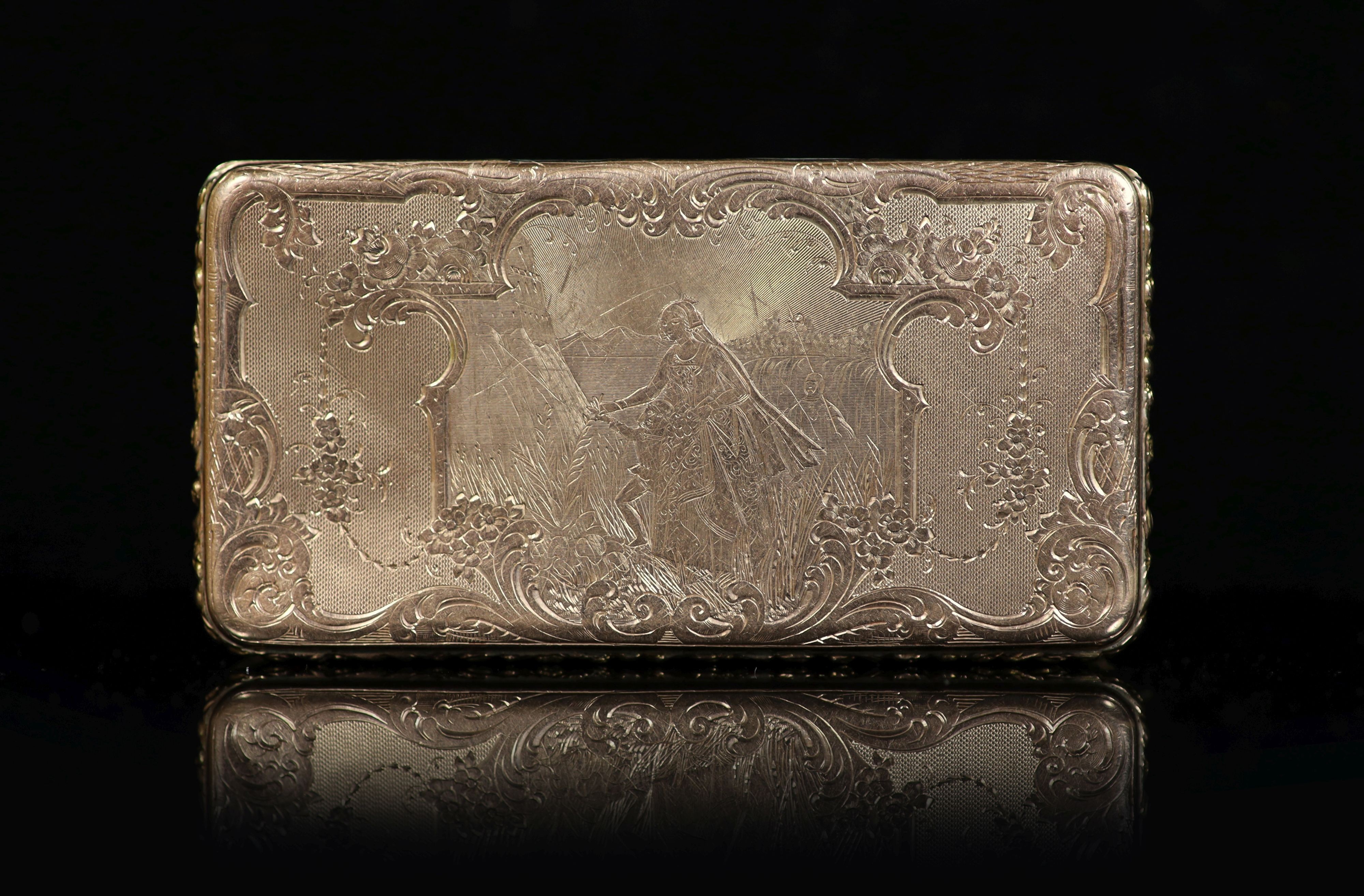 An early 19th century French engraved and engine turned gold rectangular snuff box, with hinged cover